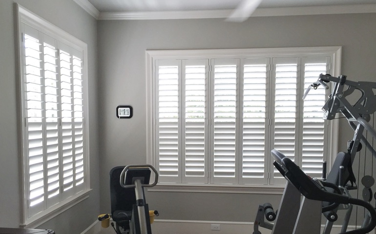 Gainesville fitness room with shuttered windows.